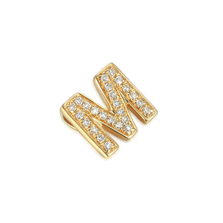 Gold letter 'M' earrings with clear gemstones on a white background