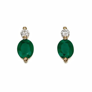 Pair of emerald green earrings with gold and clear stone accents on a white background