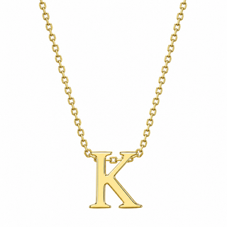 A gold initial necklace featuring a polished capital letter 'K' pendant on a delicate gold chain, shown against a plain white background.
