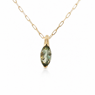 A gold chain necklace with a marquise-cut green gemstone pendant, accented by small clear stones in the bail, shown on a white background.