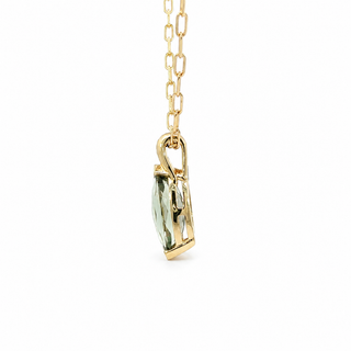 A gold chain necklace with a vertical bezel-set green gemstone pendant, shown against a plain white background.
