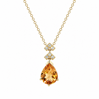 A gold chain necklace featuring a teardrop-shaped orange gemstone pendant, accented by two small diamond-like cubic zirconia clusters on each side of the chain, set against a plain white background.