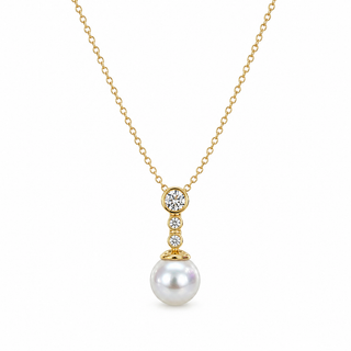 A gold chain necklace featuring a pendant with a large white pearl and three small clear stones in a gold setting, shown on a plain white background.