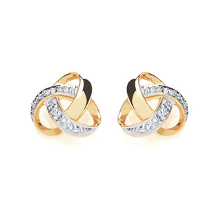 A pair of gold and silver interlocking knot stud earrings, each adorned with a row of clear pavé-set stones, shown on a clean white background.