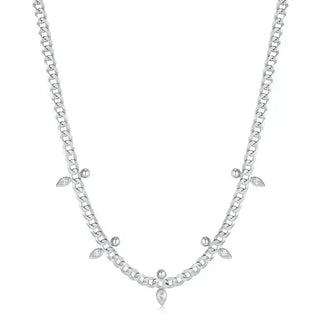 A sterling silver curb chain necklace with cubic zirconia embellishments.