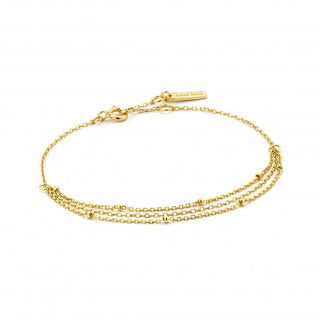 Gold bracelet with a clasp on a white background