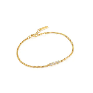 A gold-plated bracelet with a cubic zirconia embellishment in the center, with a chunky square chain design.