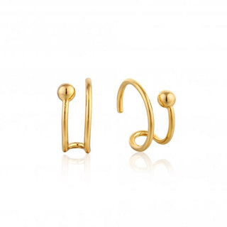 Gold hoop earrings on a white background