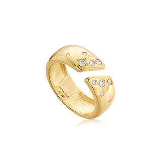 Gold ring with embedded diamonds on a white background