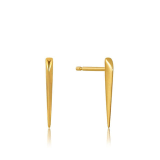 A pair of golden straight spike stud earrings against a white background.