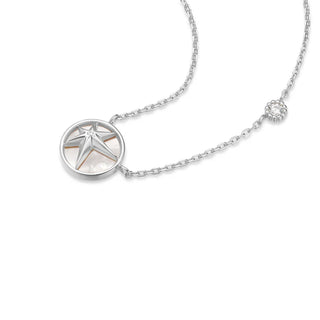 silver necklace with a star pendant on a white background