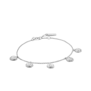 Silver bracelet with round charms on a white background
