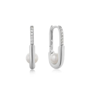 Silver earrings with pearls and small diamonds on a white background