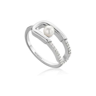 Silver ring with a pearl and small diamonds on a white background