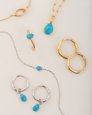 Ania Haie jewellery set with turquoise stones on a light background