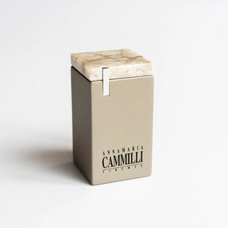 Beige box with marble lid and 'Annamaria Cammilli' branding on a white background
