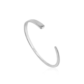 A sterling silver bracelet with a flat cuff design, displayed against a white background.