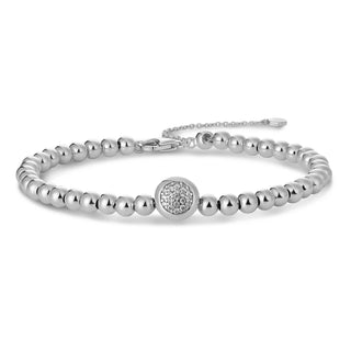 Silver bracelet with a central round clasp on a white background