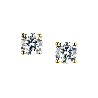 Pair of gold and clear gemstone stud earrings on a white background