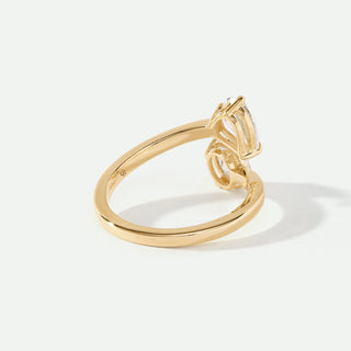 Gold ring with a diamond on a white background