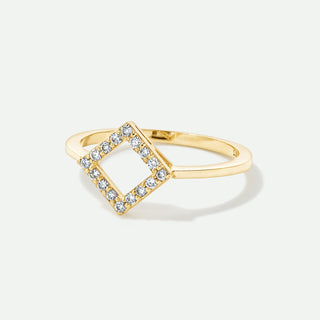 Gold ring with diamond accents on a white background