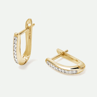 Gold hoop earrings with diamond accents on a white background