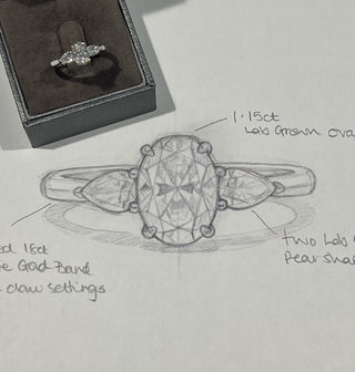 Three Stone Oval Diamond ring with its design sketch on paper