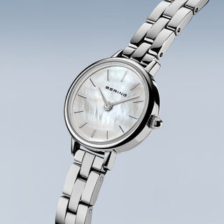 Silver Bering watch with a white face on a light gray background