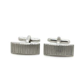 Pair of silver rectangular cufflinks on a white background