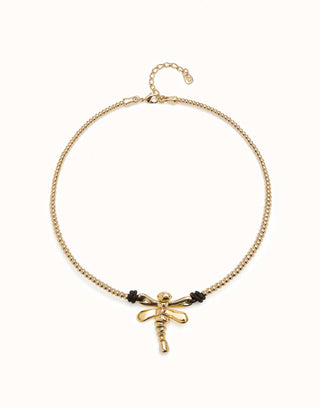 A golden-colored necklace with a central dragonfly-shaped pendant, featuring leather