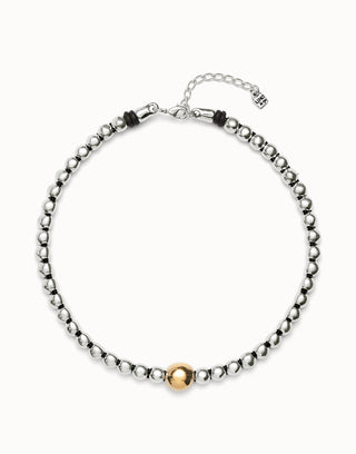 Necklace with metal beads on a white background