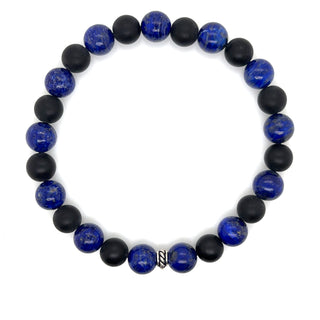 Bracelet with blue and black beads on a white background