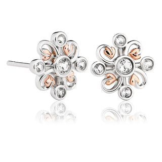 A pair of Clogau Tree of Life Clover earrings crafted from 9ct rose gold and featuring diamond-cut white topaz, with a silver and rose gold floral design.