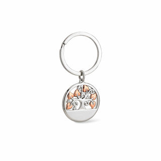 Silver keychain with a tree of life design on a white background