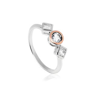 Silver ring with rose gold and clear gemstones on a white background