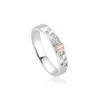 A slim band ring with a silver and rose gold design, featuring white topaz gemstones.