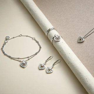 clogau cariad sparkle collection laid on a beige background