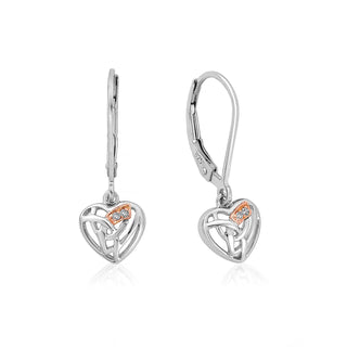 Heart-shaped earrings with intricate designs on a white background