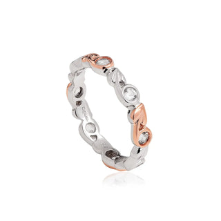 A Clogay silver band ring featuring a Tree of Life design with white topaz stones and rose gold accents.