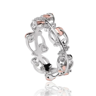 A Clogau white topaz ring featuring an intricate floral and leaf design with silver and rose gold tones.