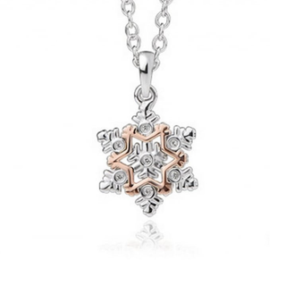 Snowflake-shaped pendant with rose gold and silver design on a white background