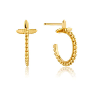 A pair of gold beaded hoop earrings with a modern design, displayed against a white background.