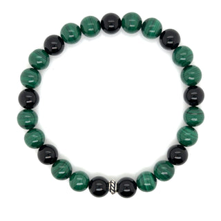 Bracelet with green malachite and black onyx beads on a white background