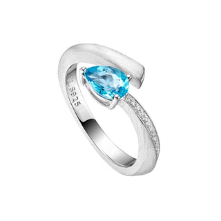 Silver ring with a blue gemstone on a white background
