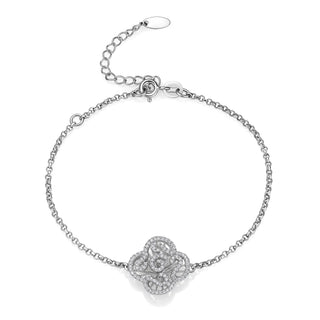 Silver bracelet with a floral clasp on a white background