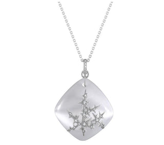 Silver necklace with a decorative pendant on a white background