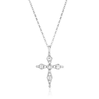 Silver cross pendant necklace on a white background