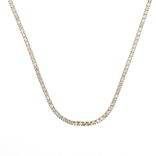 A delicate tennis-style chain necklace with small clear stones set in a yellow gold-tone metal, shown against a plain white background.