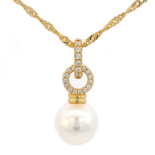 A gold necklace with a twisted chain and a pendant featuring a large white pearl and a diamond-accented circular ring, shown on a plain white background.