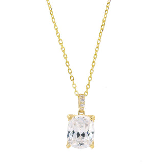 Gold necklace with a clear gemstone pendant on a white background